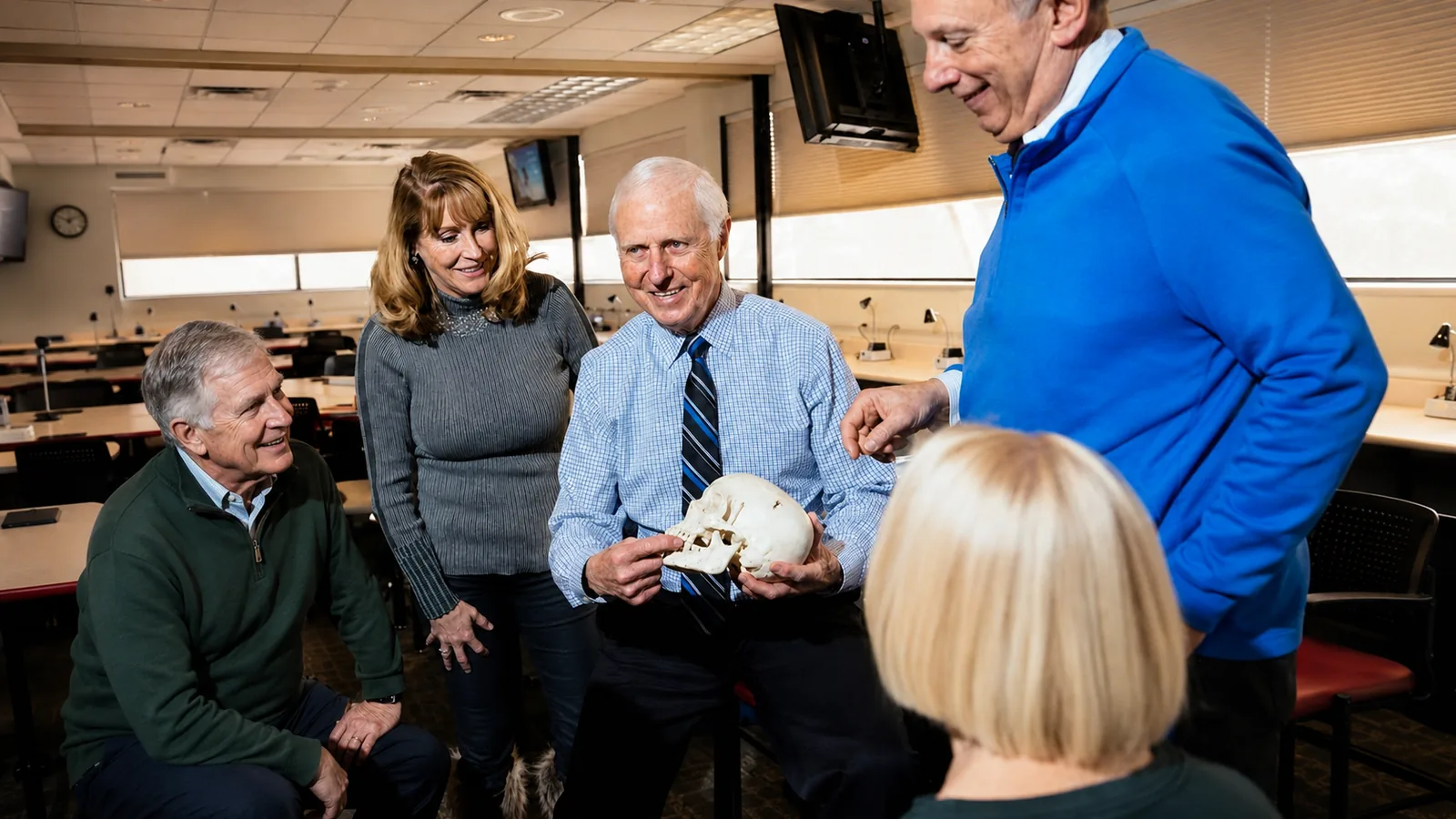 Dr. Gordon J. Christensen teaching with an anatomical skull model
